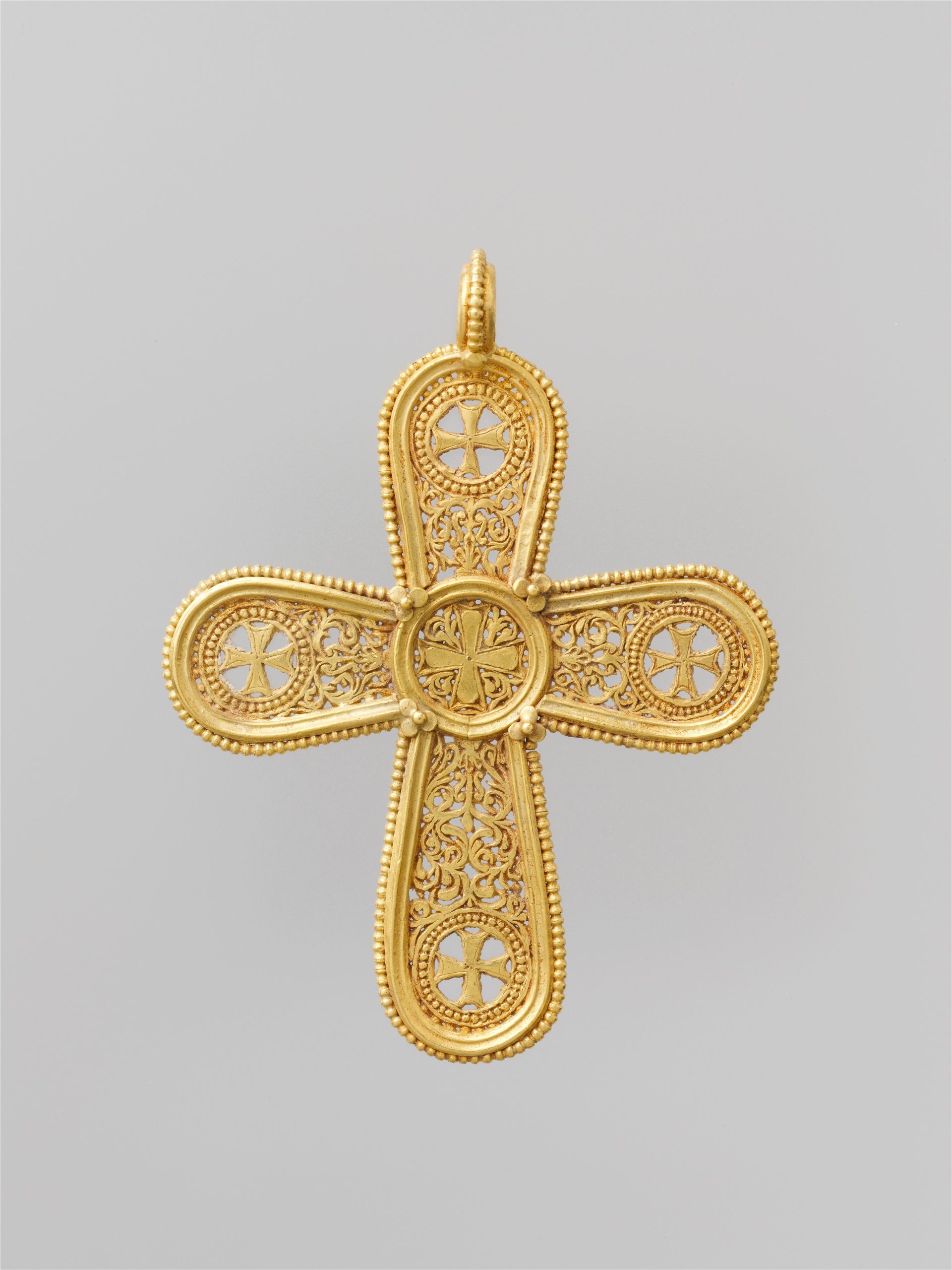 gold necklace with cross sideways